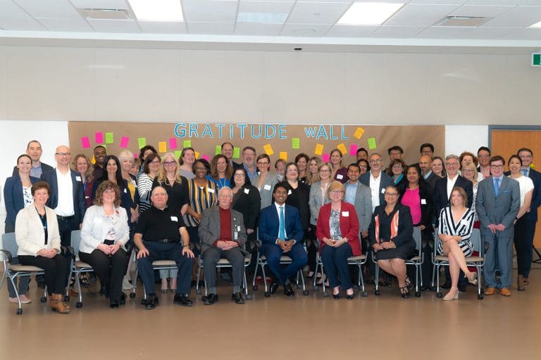 A group of health care partners posing together for a photo.